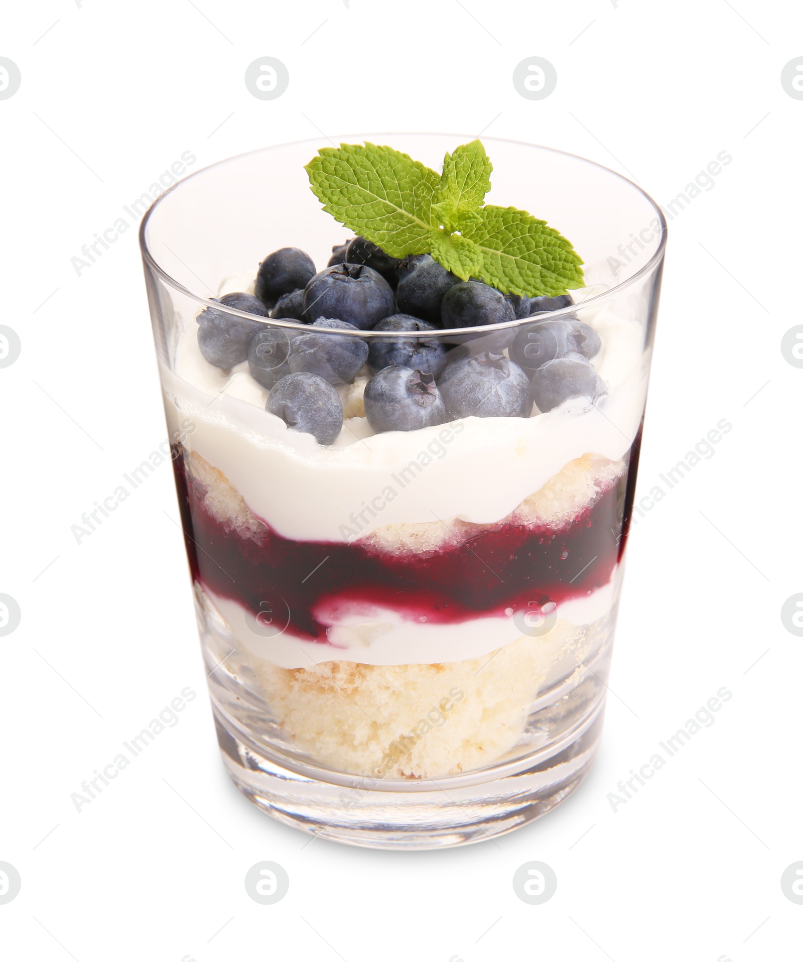 Photo of Tasty trifle dessert. Sponge cake, blueberries, jam and whipped cream in glass isolated on white