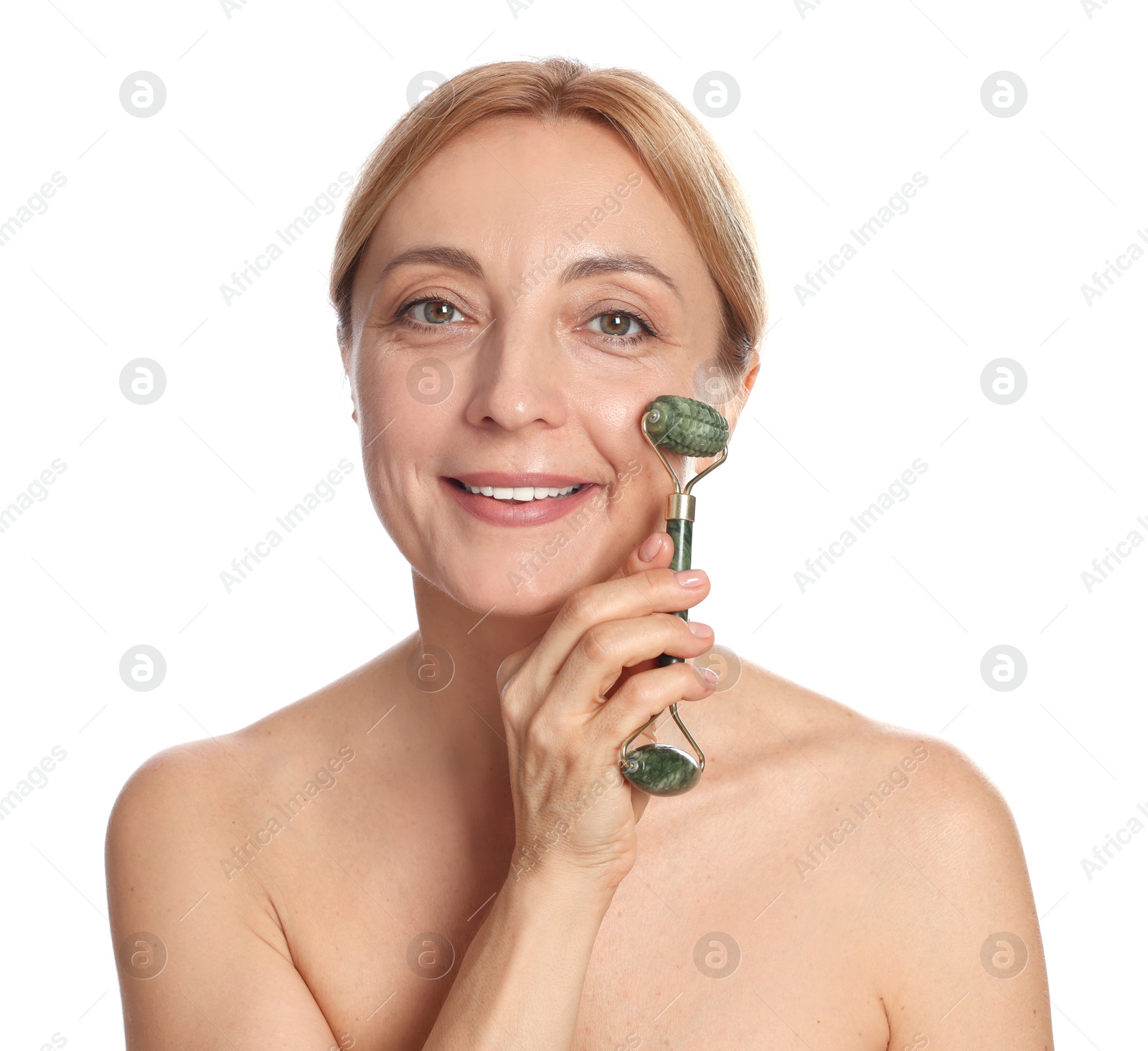 Photo of Smiling woman doing facial self massage with roller on white background