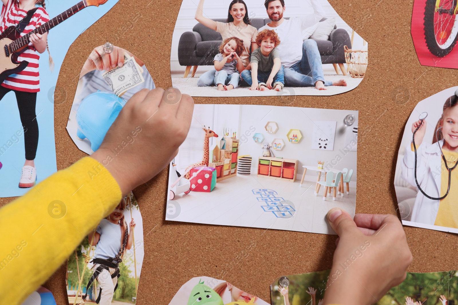 Photo of Girl creating vision board with different pictures, closeup