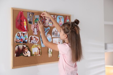 Photo of Girl creating vision board with different pictures indoors