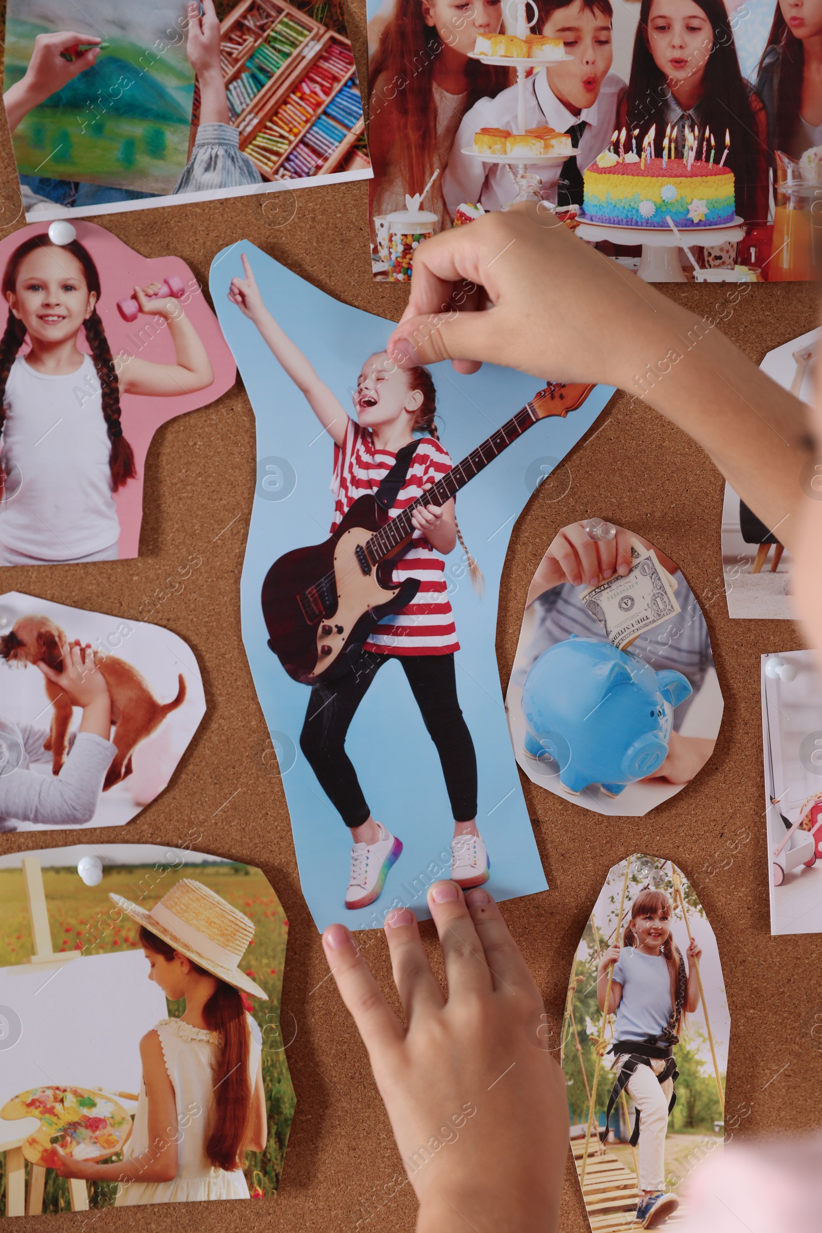 Photo of Girl creating vision board with different pictures indoors, closeup