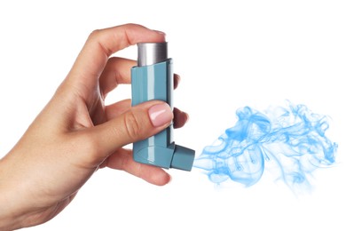 Asthma treatment. Woman holding inhaler on white background, closeup. Aerosolized medication coming out of device