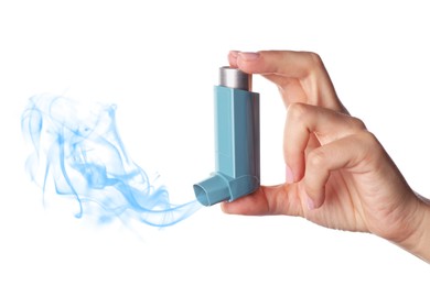 Asthma treatment. Woman holding inhaler on white background, closeup. Aerosolized medication coming out of device