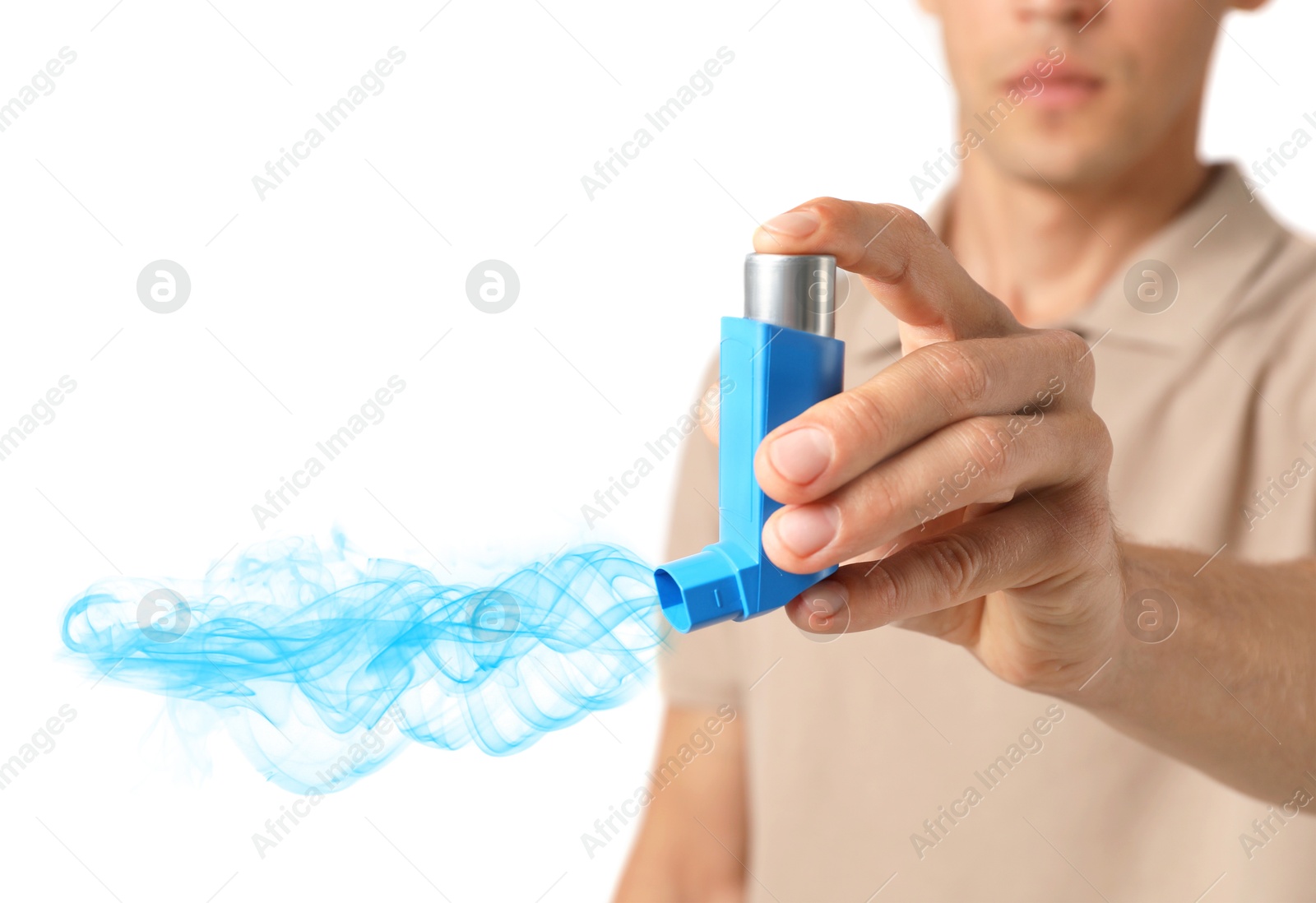 Image of Asthma treatment. Man holding inhaler on white background, closeup. Aerosolized medication coming out of device