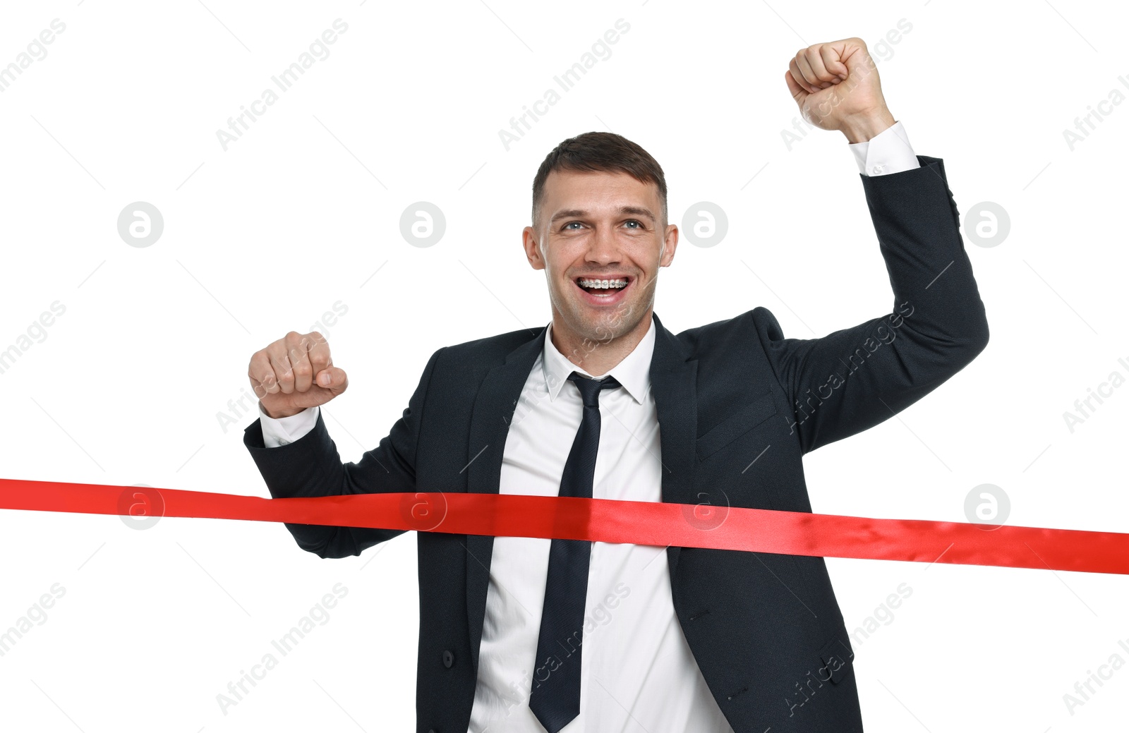 Photo of Businessman in suit crossing red finish line on white background