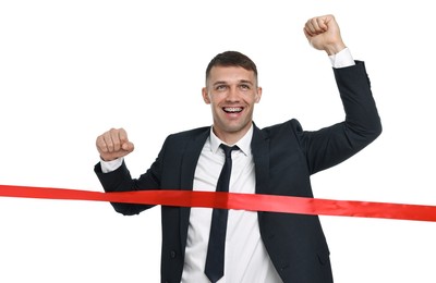 Photo of Businessman in suit crossing red finish line on white background