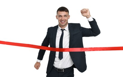 Photo of Businessman in suit crossing red finish line on white background