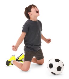 Emotional football player with soccer ball on white background