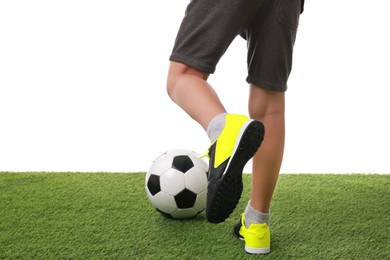 Photo of Football player with soccer ball on artificial grass against white background, closeup