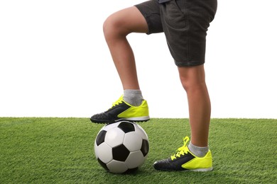 Football player with soccer ball on artificial grass against white background, closeup