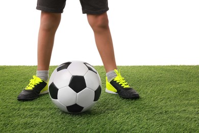 Football player with soccer ball on artificial grass against white background, closeup