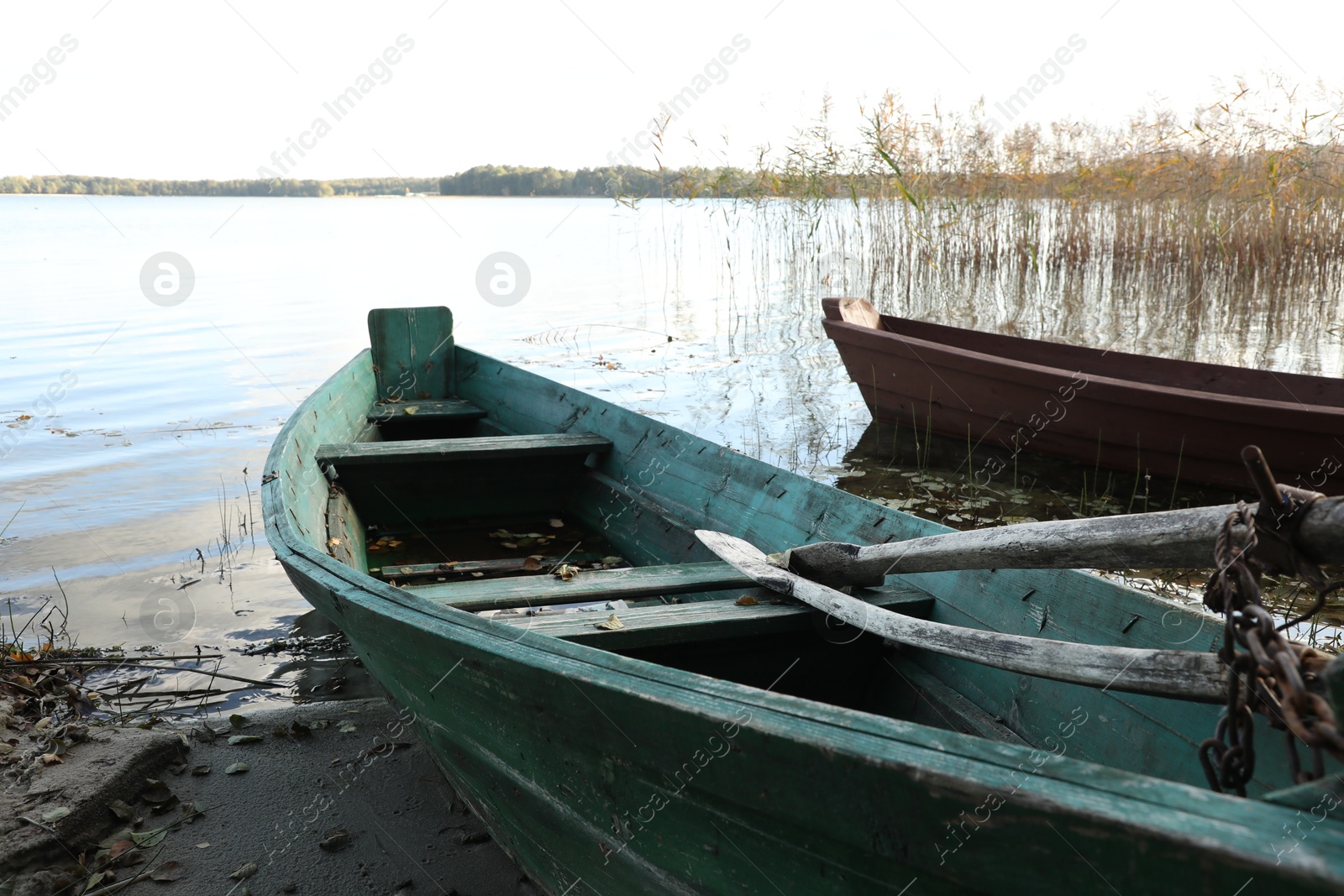 Photo of Two old wooden boats on river, closeup