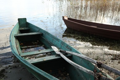 Photo of Two old wooden boats on river, closeup