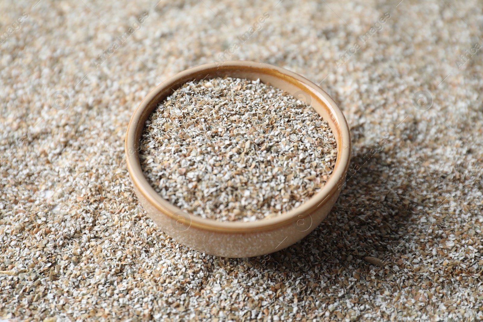 Photo of Bowl with fresh rye bran, closeup view