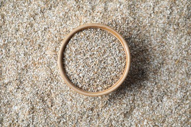 Photo of Bowl with fresh rye bran, top view