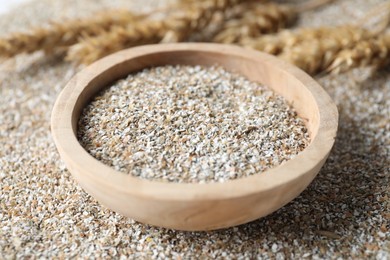 Photo of Bowl with fresh rye bran, closeup view