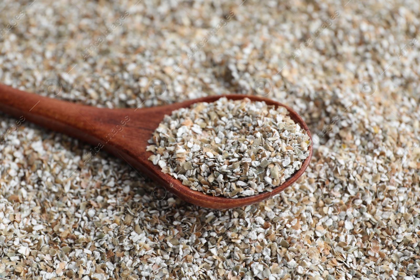 Photo of Spoon with fresh rye bran, closeup view