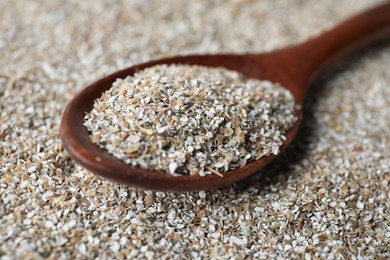 Photo of Spoon with fresh rye bran, closeup view