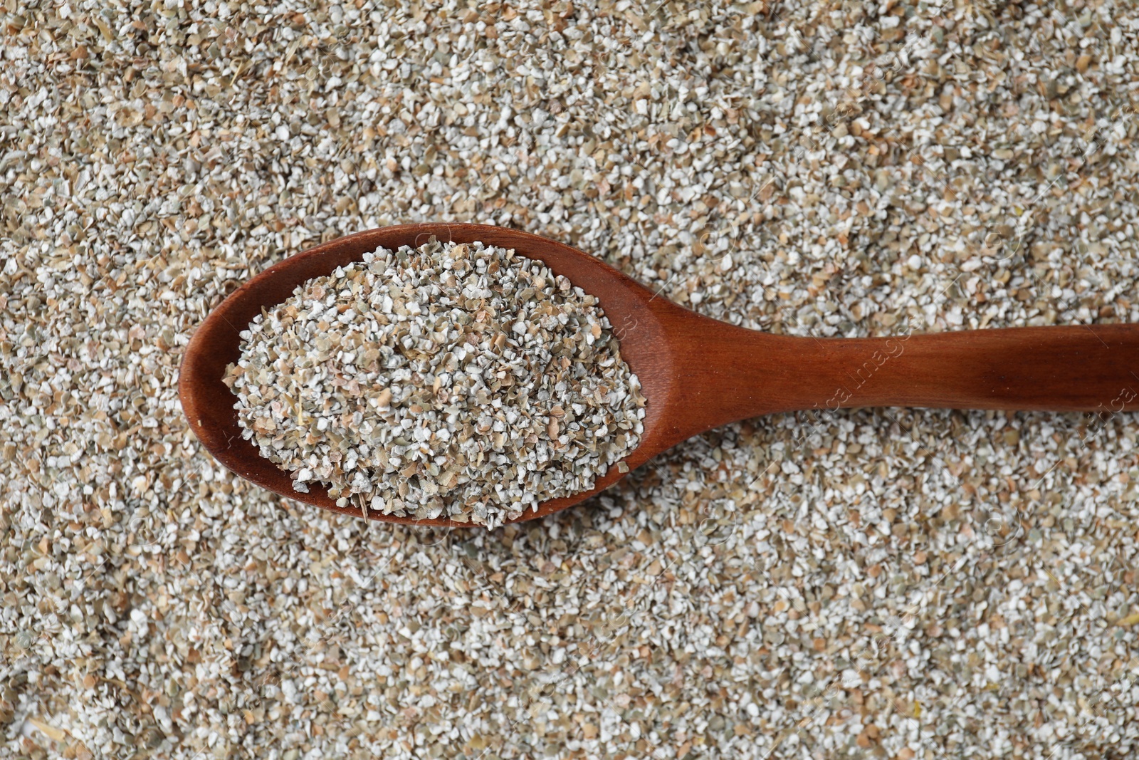 Photo of Spoon with fresh rye bran, top view