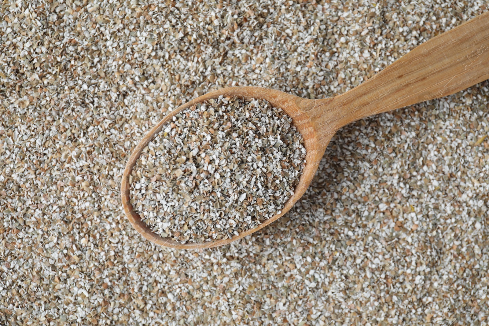 Photo of Spoon with fresh rye bran, top view