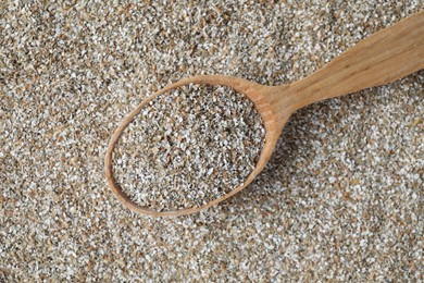 Photo of Spoon with fresh rye bran, top view