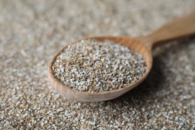 Photo of Spoon with fresh rye bran, closeup view