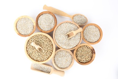 Photo of Bowls with fresh rye bran, kernels, spoon and scoops on white background, top view