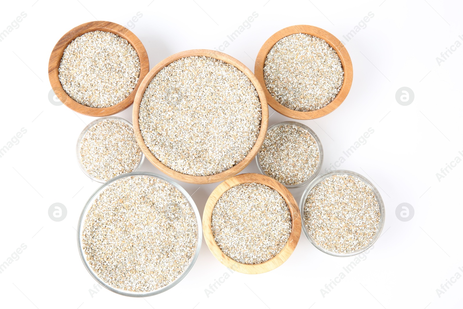 Photo of Fresh rye bran in bowls on white background, top view