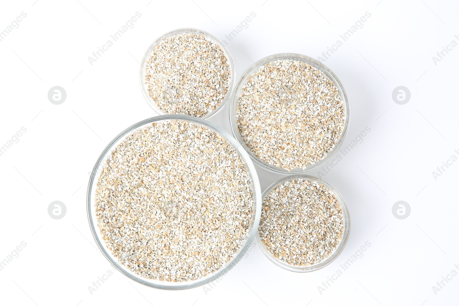 Photo of Fresh rye bran in bowls on white background, top view