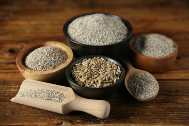 Photo of Fresh rye bran in bowls, kernels and scoop on wooden table, closeup