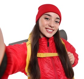 Photo of Smiling young woman with backpack taking selfie on white background. Active tourism