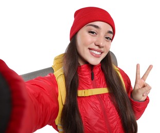 Photo of Smiling young woman with backpack taking selfie on white background. Active tourism