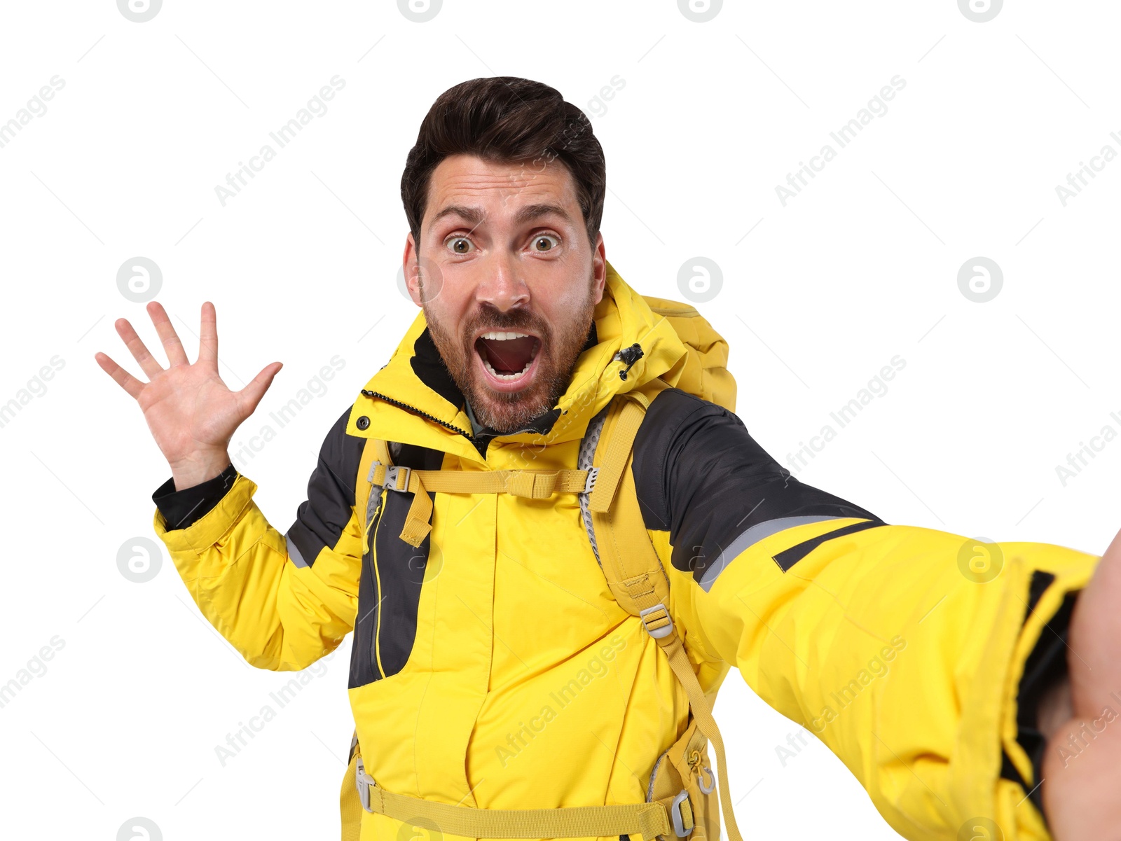 Photo of Emotional man with backpack taking selfie on white background. Active tourism