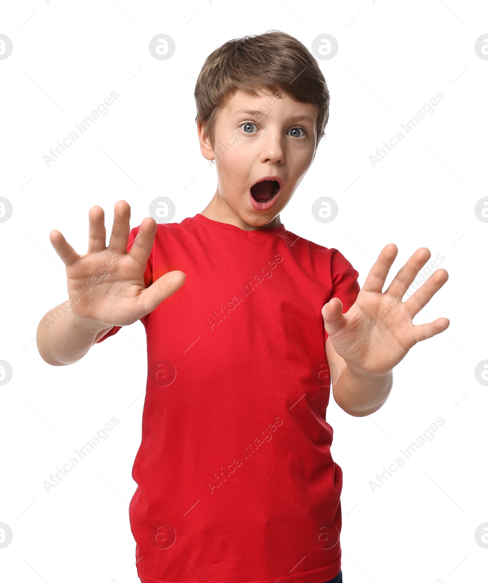 Photo of Portrait of scared little boy on white background