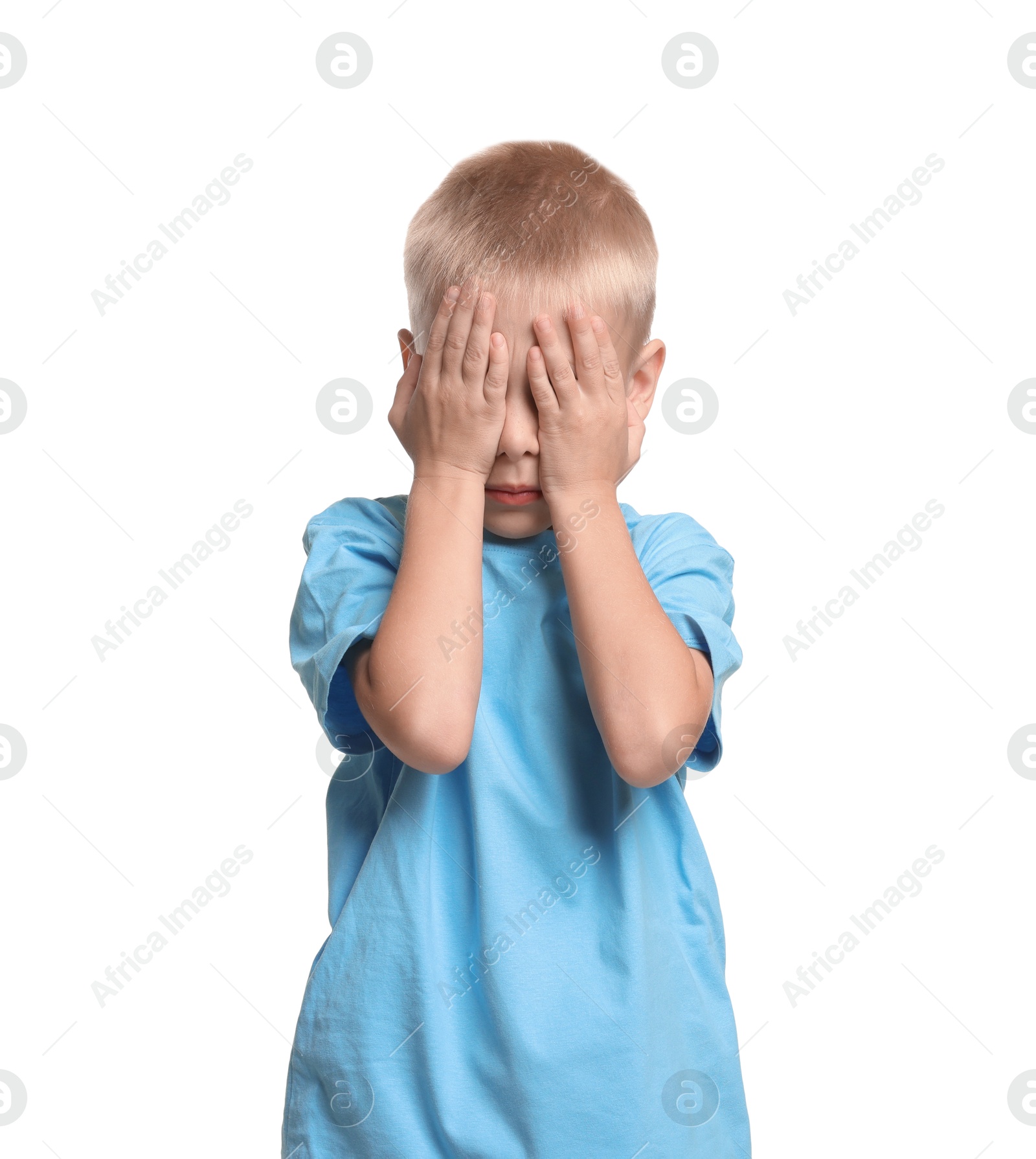 Photo of Scared little boy covering face with hands on white background