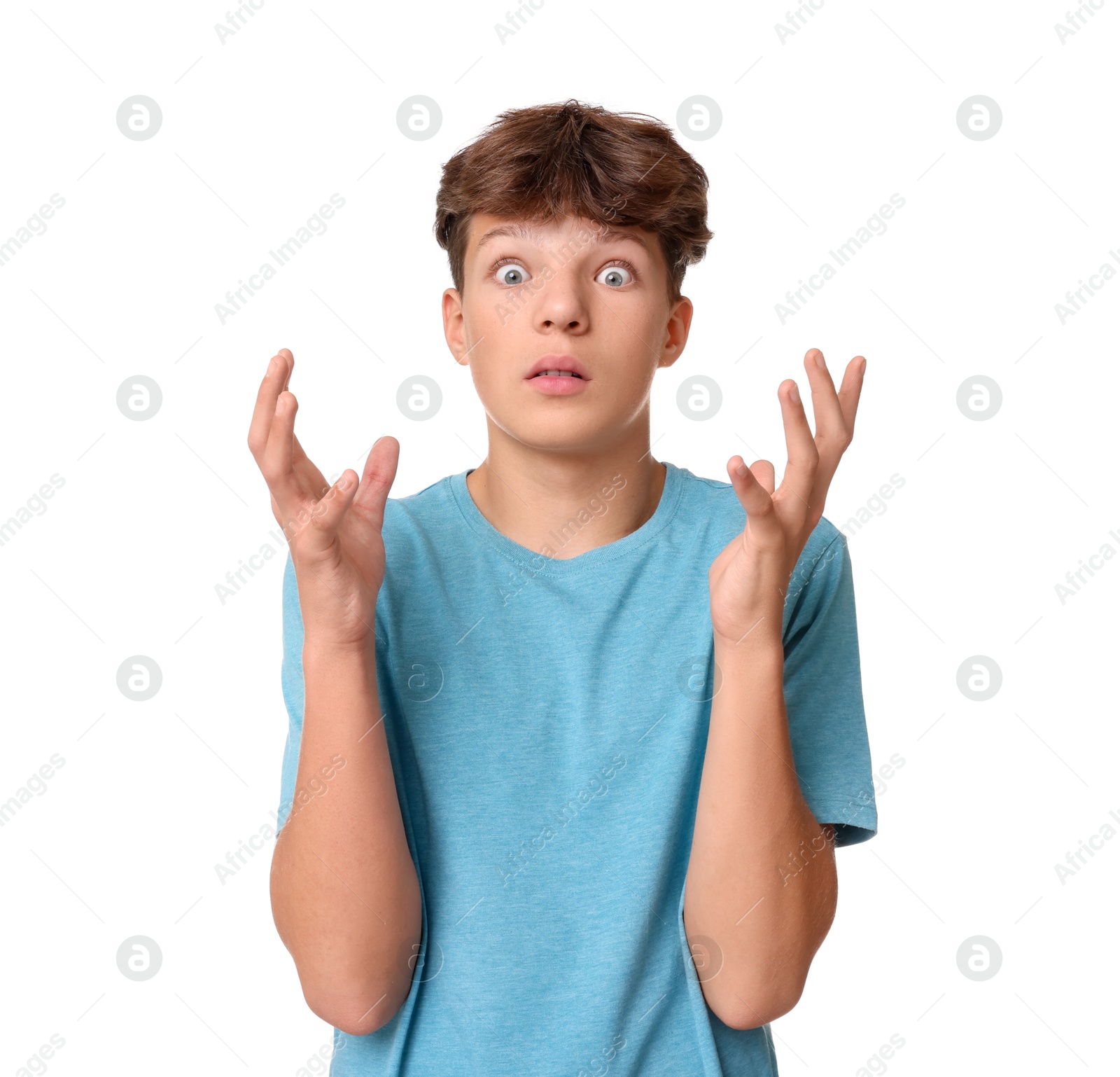 Photo of Portrait of scared teenage boy on white background