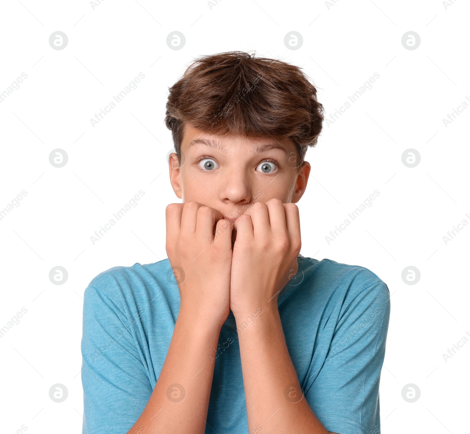 Photo of Portrait of scared teenage boy on white background