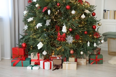 Many gifts under Christmas tree at home