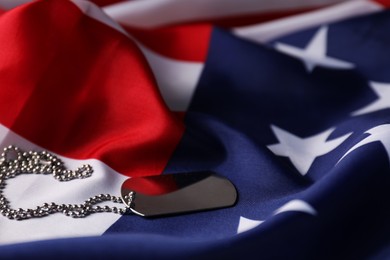 Photo of Veterans day. Army token and American flag, closeup