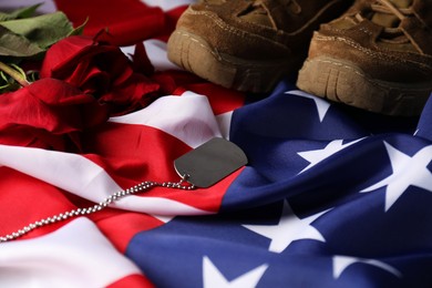 Photo of Veterans day. American flag, roses and army token, closeup