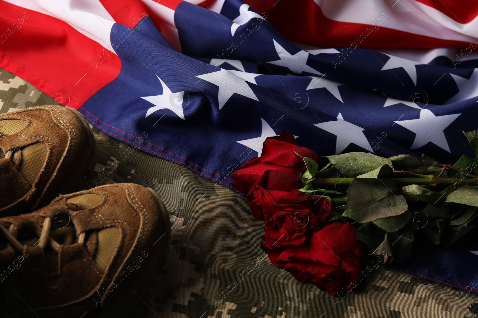 Photo of Veterans day. American flag, roses and military uniform, flat lay