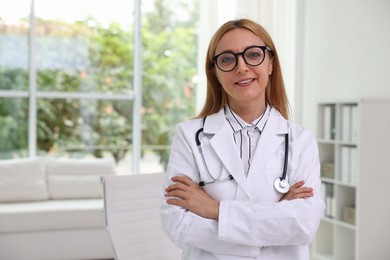 Portrait of smiling doctor with stethoscope in clinic