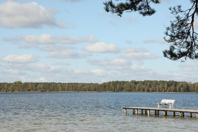 Photo of Beautiful view of river, deck and green forest