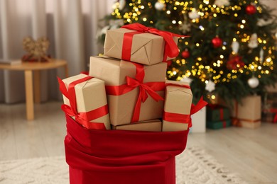 Photo of Santa bag full of Christmas presents at home