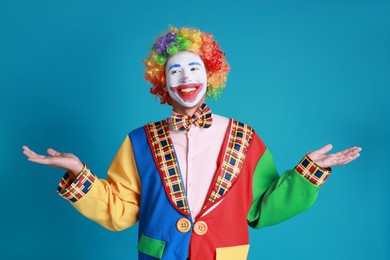 Photo of Portrait of happy clown on blue background