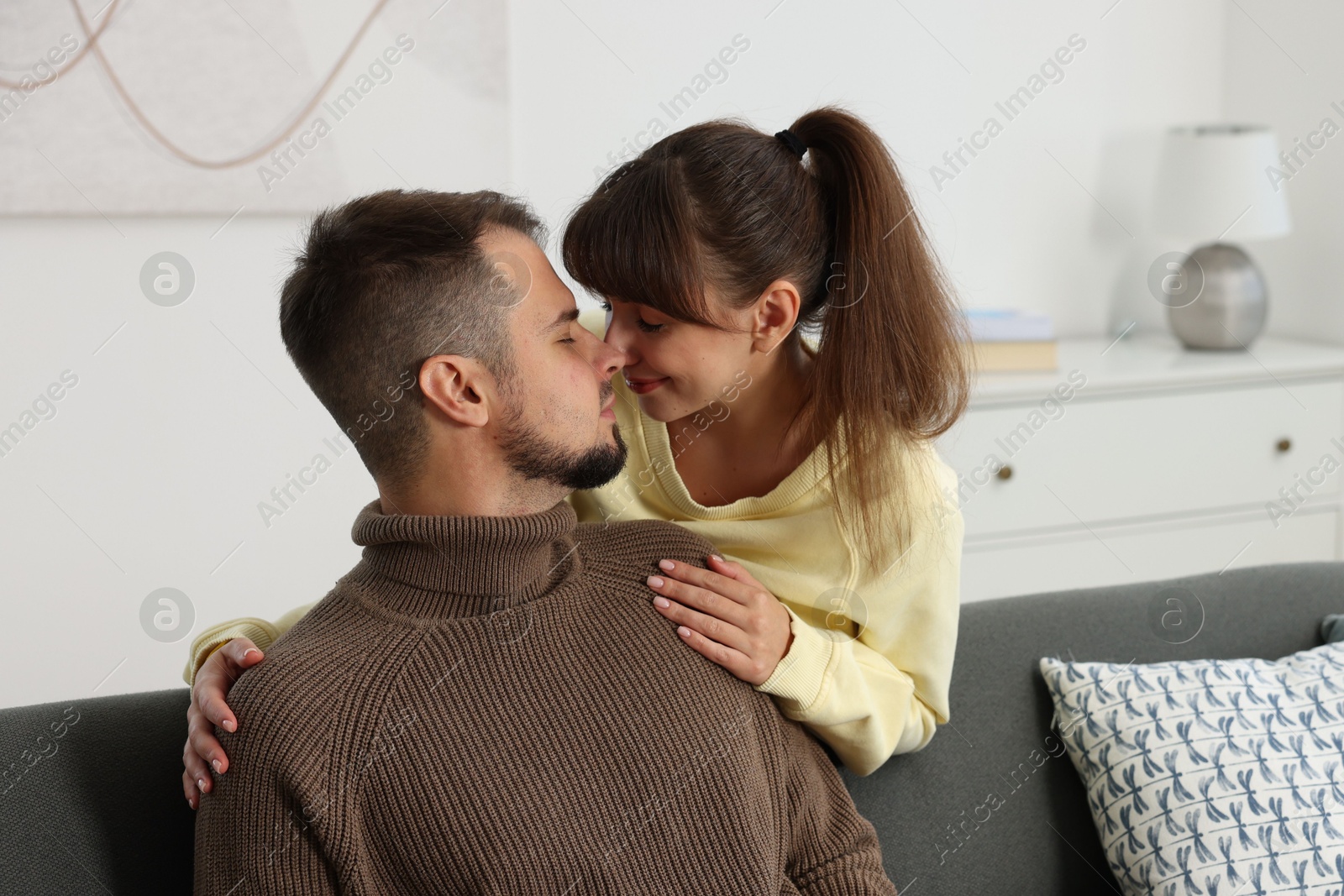 Photo of Portrait of happy lovely couple at home