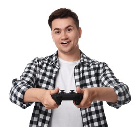 Young man playing video games with controller on white background