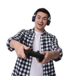 Photo of Happy young man in headphones playing video games with controller on white background