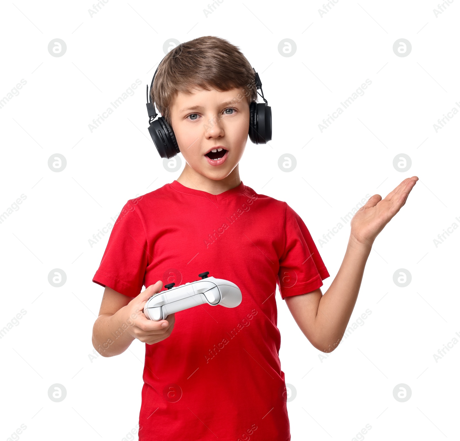 Photo of Cute little boy in headphones with controller on white background