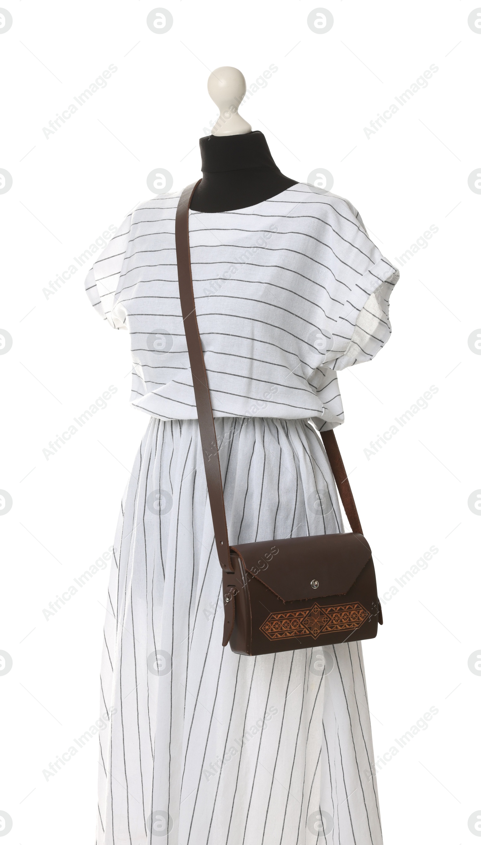 Photo of Female mannequin with stylish dress and brown bag isolated on white